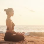 Young,Woman,Sitting,In,Lotus,Position,And,Does,Yoga,For