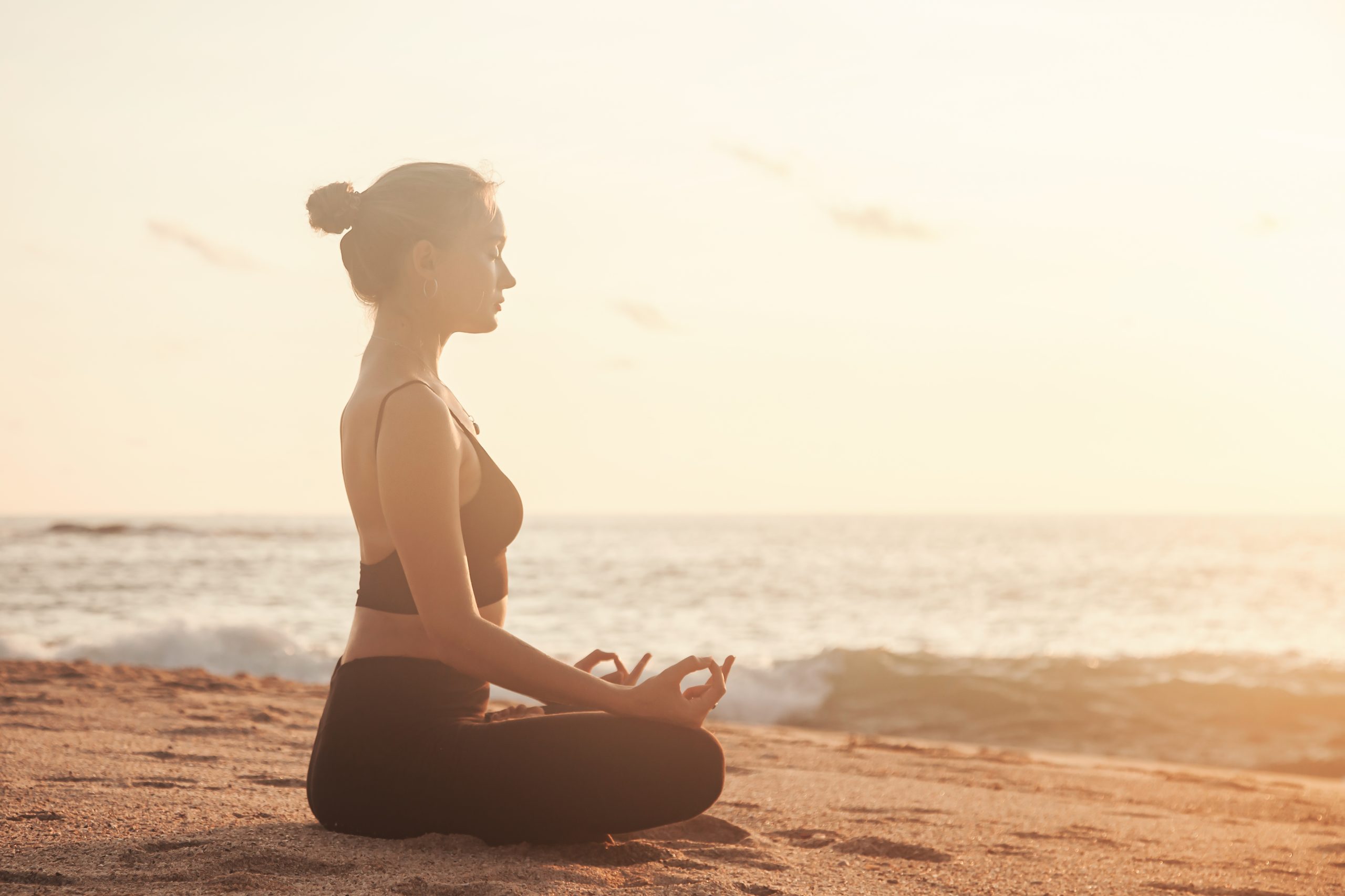 Young,Woman,Sitting,In,Lotus,Position,And,Does,Yoga,For