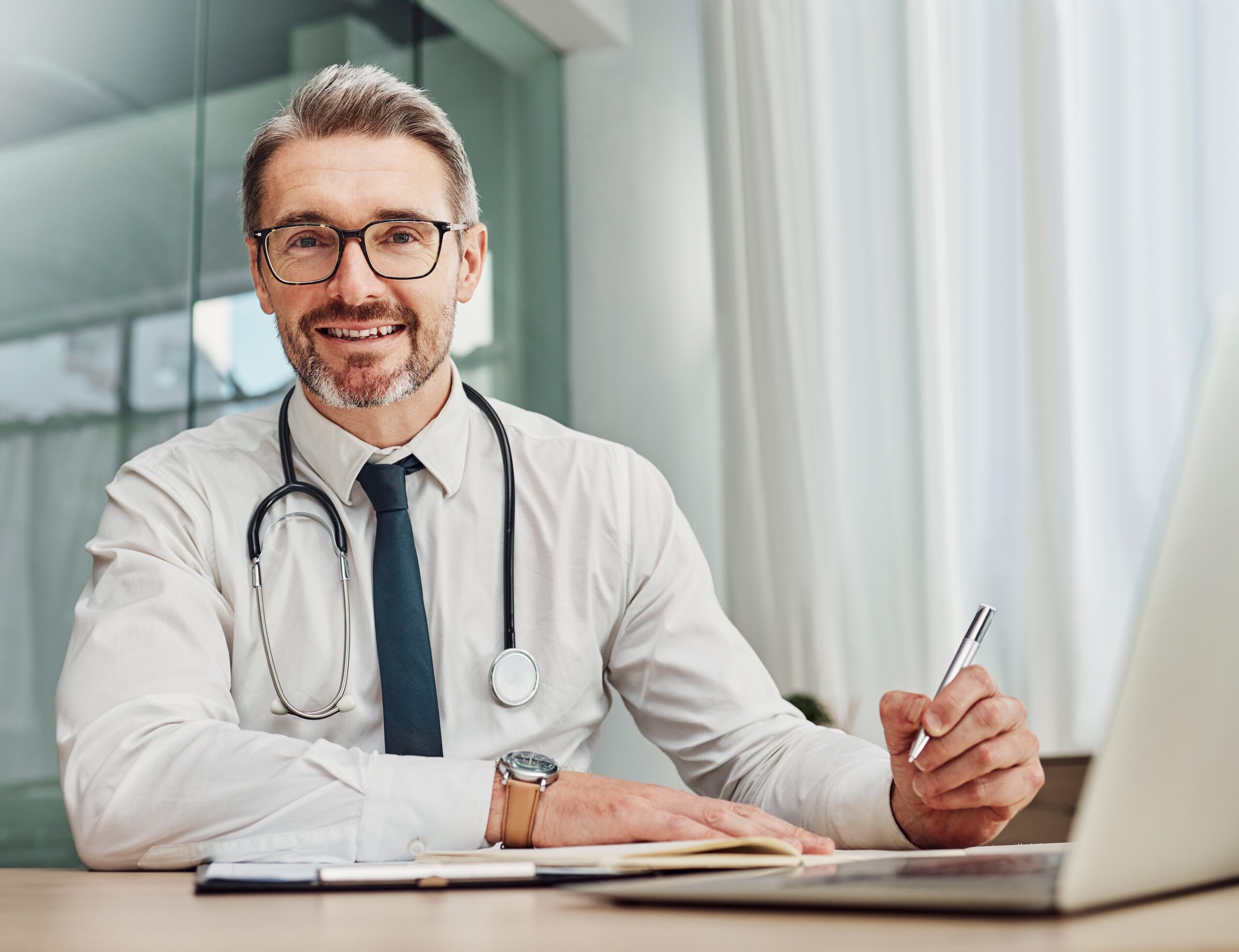 Male Doctor On Phone Scaled